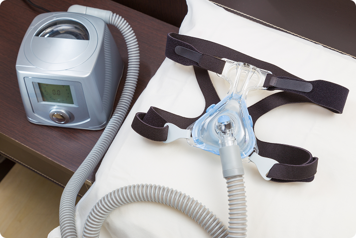 CPAP machine and supplies on a bedside table